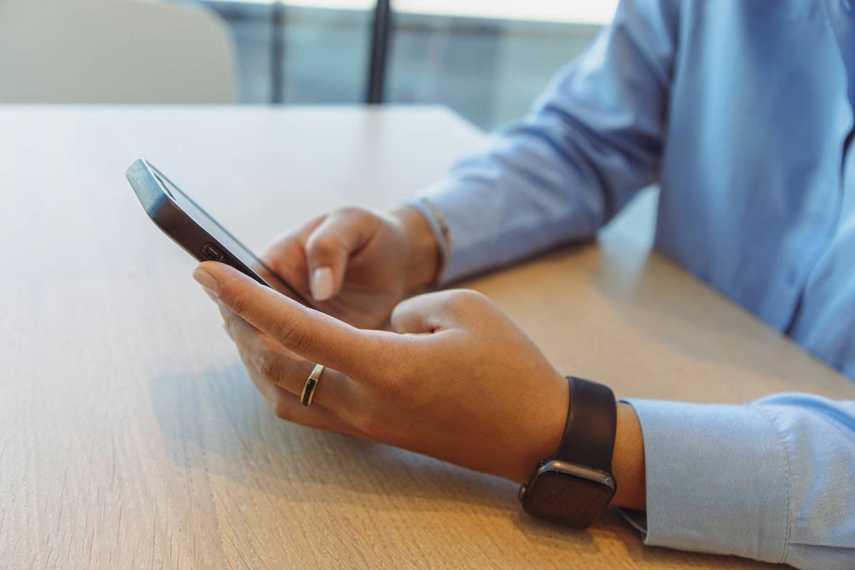 Business woman with phone and watch